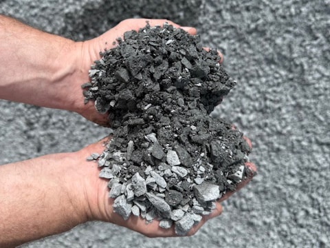 Two hands holding 5/8" minus crushed rock